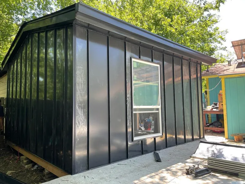 Black standing seam metal wall panels for Roof Inspection in Algona