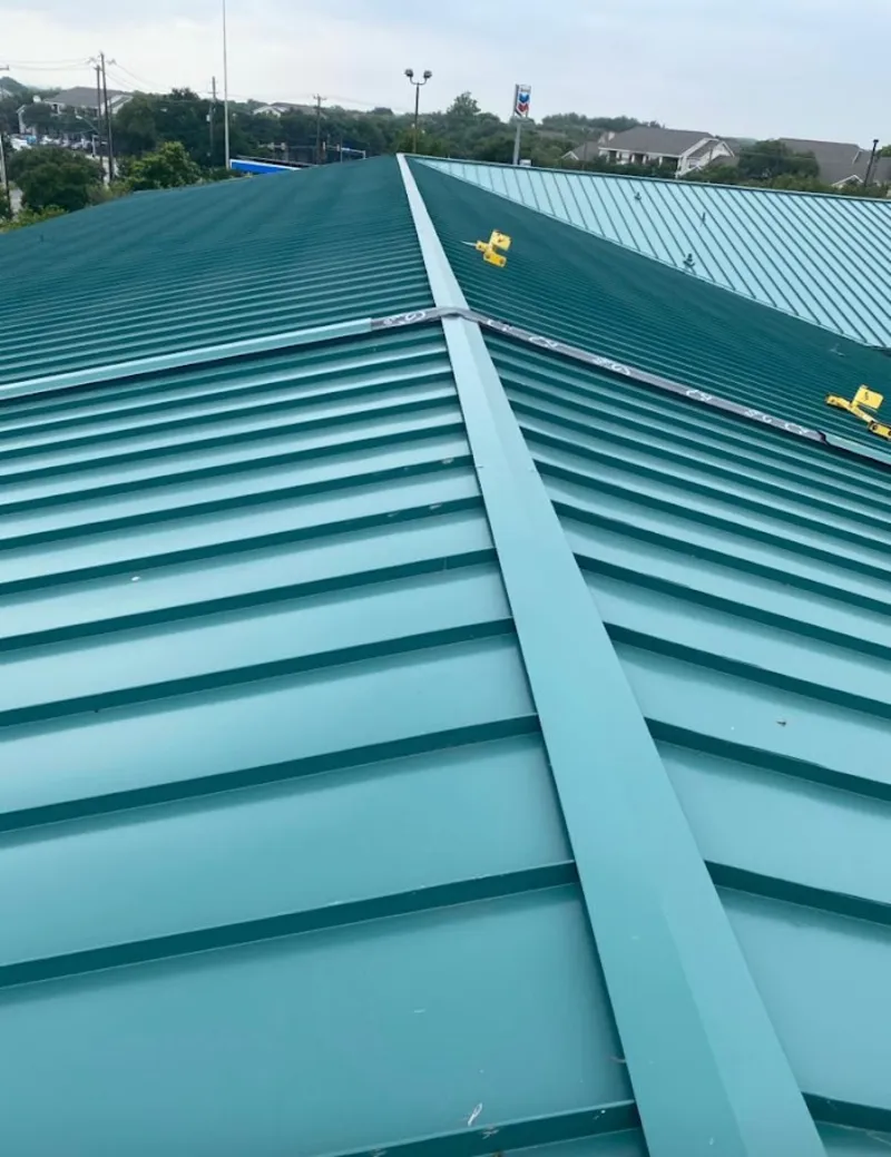 Green commercial metal roof ridge and valley for Metal Roof Repair in Algona